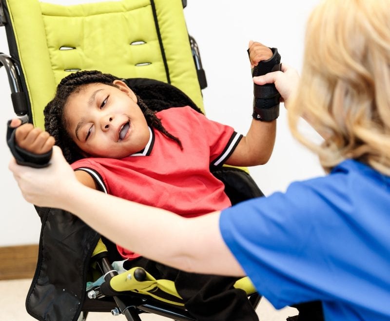 therapy with a child in a wheelchair