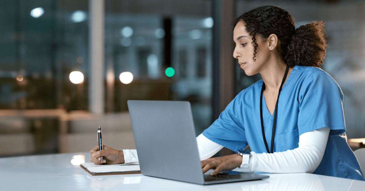 a nurse writing down notes