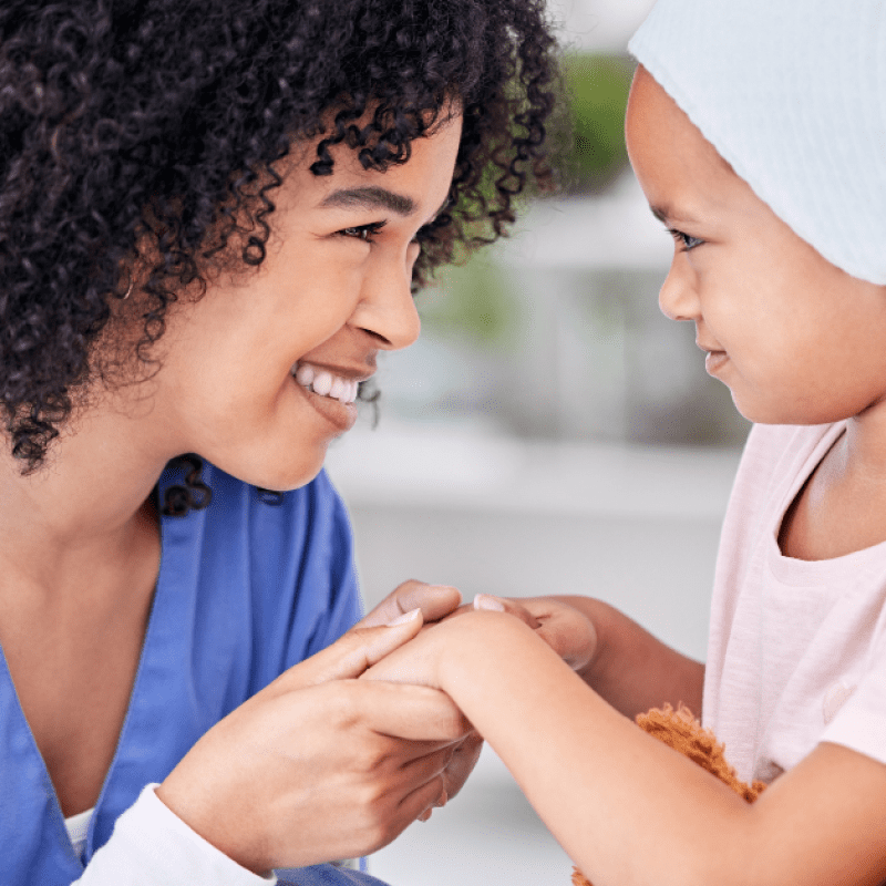 nurse helping a child who is medically fragile, holding her hand "Role of Home Health Care in Palliative & Hospice Support for Pediatric Patients."