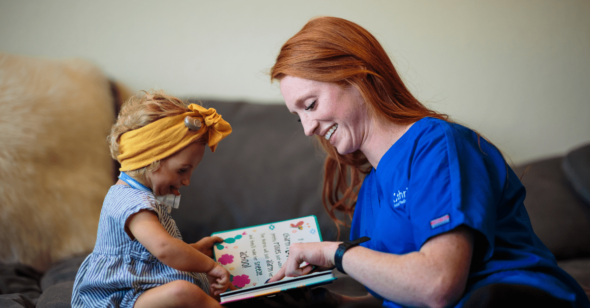 nurse reading a book to a patient - Build Communication with Non-Verbal Pediatric Patients