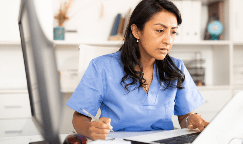 nurse on the computer "Continuing Education as a Pediatric Home Care Nurse"